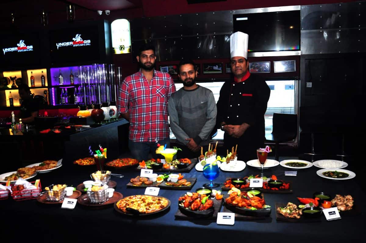 Underdoggs Guwahati franchise owner Rahul Jasrasaria (R) and brand manager at Underdoggs Karan Chadha introducing the new menu and other exclusive offers at the Underdoggs Sports Bar & Grill in Guwahati on December 2, 2016. Photo by Underdoggs/Life’s Purple