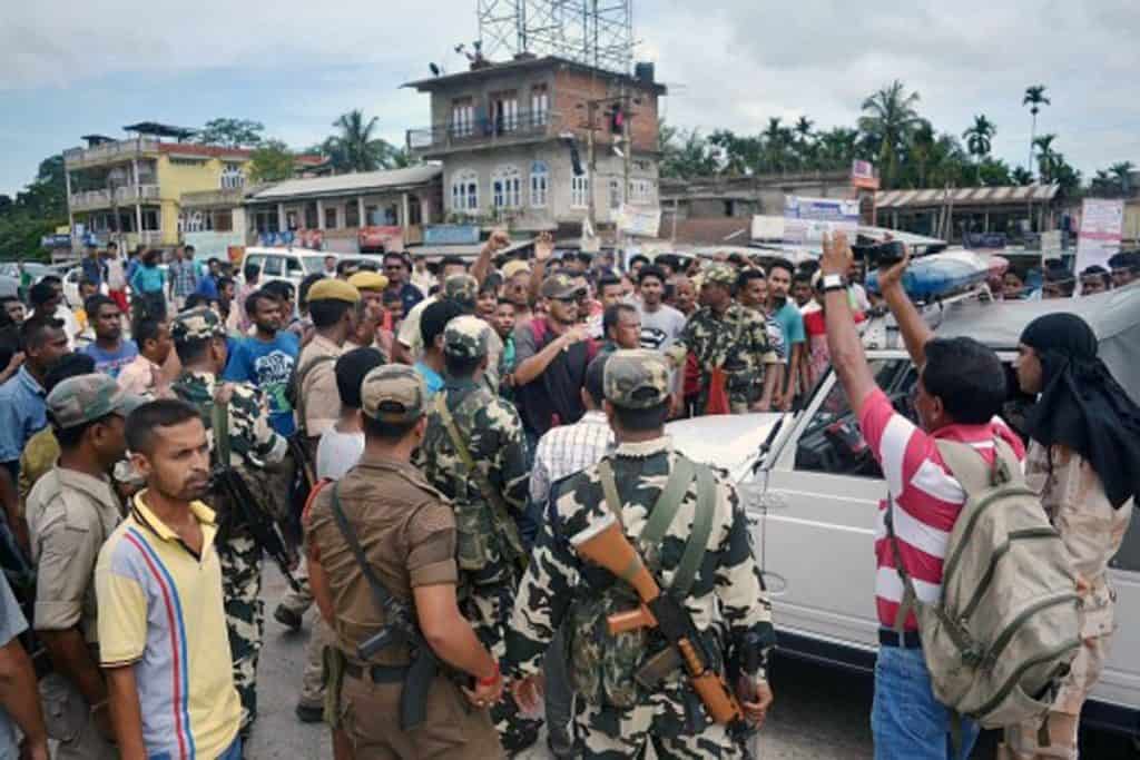 People block the National Highway demanding setting of the AIIMS at Raha in Nagaon district of Assam