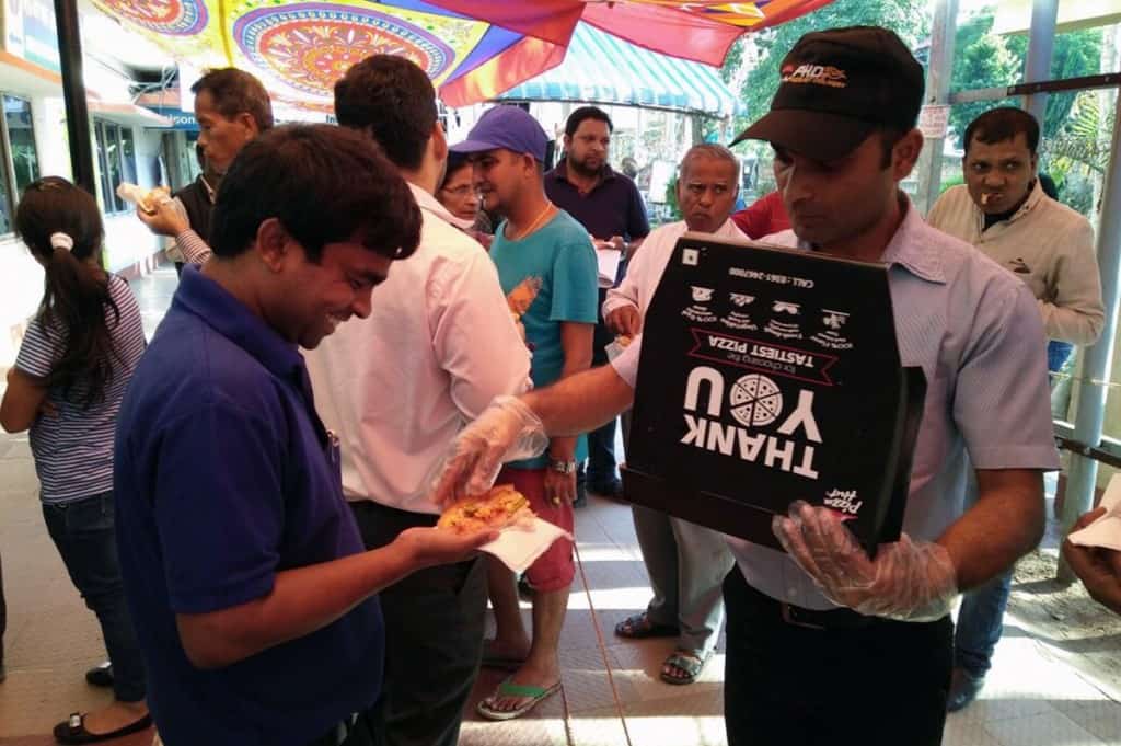 Pizza Hut distributing free pizza for the people waiting in queues 1 – The News Mill