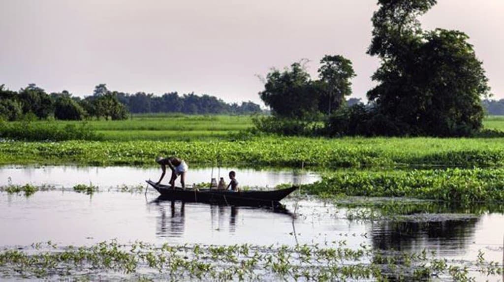 Father and son in a boat in Majuli1 – The News Mill