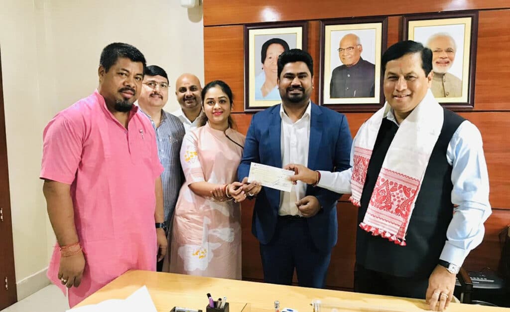 Mr. Jose Charles Martin Managing Director The Martin Group of Companies handing over a cheque for INR 1 crore to the Honourable Chief Minister of Assam Shri. Sarbananda Sonowal towards flood relief – The News Mill