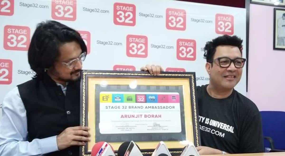 Arunjit Borah (right) displaying the certificate of Stage 32