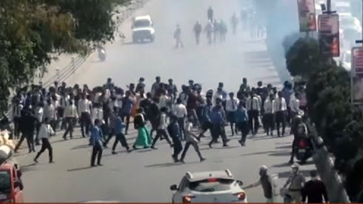 Police firing tear gas shells to disperse a rally of students