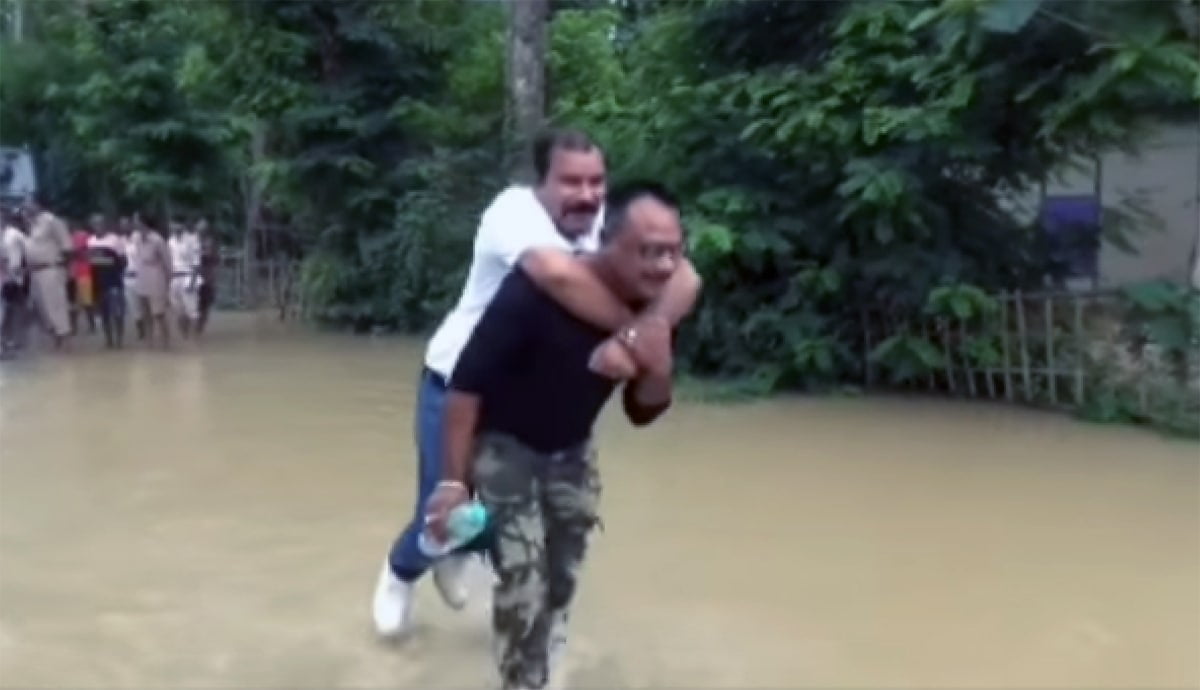 On flood inspection visit, Assam BJP MLA takes 'piggyback' ride to avoid water