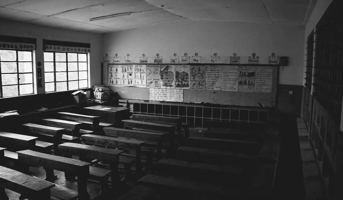grayscale photo of classroom students india